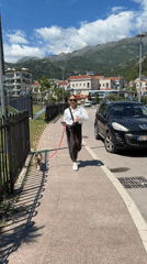 Casual midday activity captured around Budva parking lot and sidewalks