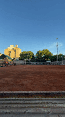 Tennis player practices forehand on Buenos Aires clay court