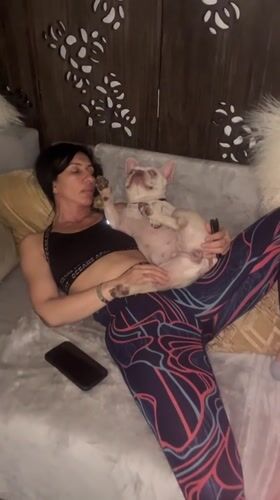London woman enjoys quiet evening at home with pets