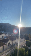 Dawn breaks over Budva's white rooftops and rocky coast