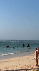 Busy Kuta Selatan beach morning: surf, sand, and monkeys nearby