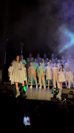 Choir performance featuring children and adults held in Tivat theater