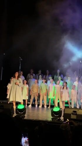 Choir performance featuring children and adults held in Tivat theater