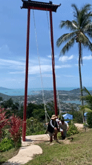 Tourist visits scenic Ko Samui hilltop swing viewpoint