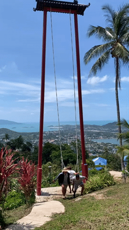 Tourist visits scenic Ko Samui hilltop swing viewpoint
