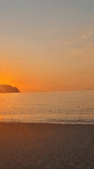 Witness captures sunset/sunrise over ocean from beach May 24
