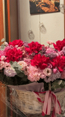 Flower basket with pink ribbon observed in Moscow