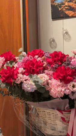 Flower basket with pink ribbon observed in Moscow