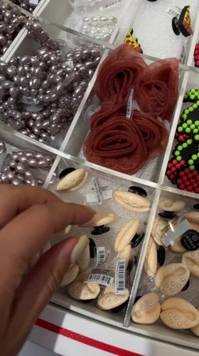Shopper browses Crocs charms and body wash in Da Nang store