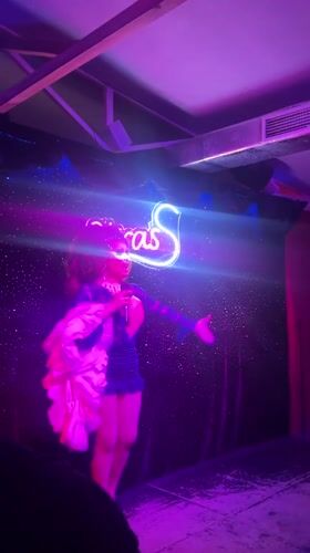 Drag performer sings on stage in Torremolinos, Spain