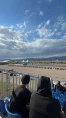 Spectators watch track race from bleachers in Sliven