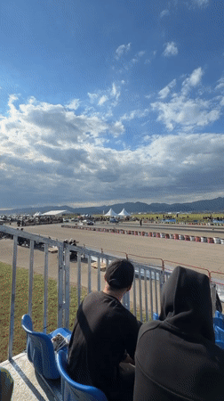 Spectators watch track race from bleachers in Sliven