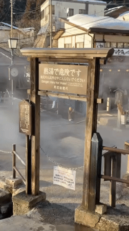 Steam rises from hot springs in Nozawaonsen, Japan