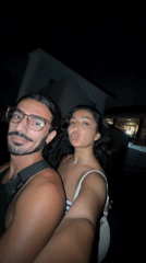 Couple rides motorbike while taking selfie in North Kuta