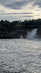 Dramatic waves crash against cliffs at Nusa Penida, Indonesia