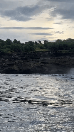 Dramatic waves crash against cliffs at Nusa Penida, Indonesia