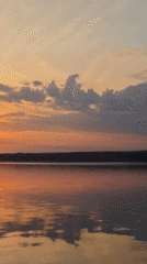 Evening lakefront stroll captured in Chaikovsky, Russia