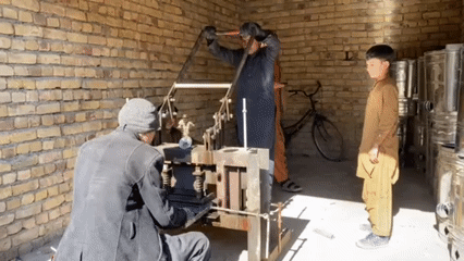 Metalworkers fabricate materials in Kandahar workshop