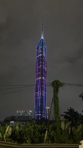Illuminated skyscrapers captured in nighttime Kuala Lumpur photographs