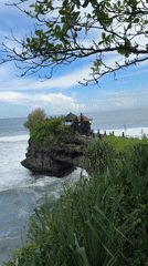 Temple on rocky outcrop filmed along Indonesian coast