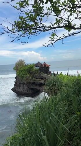 Temple on rocky outcrop filmed along Indonesian coast