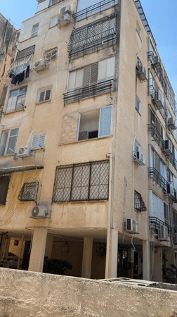 Morning street life on a residential block in Netanya