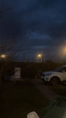Family gathering observed in nighttime residential area