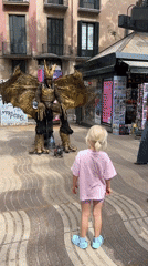 Street performers draw crowds in sunny Barcelona plaza
