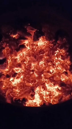 Evening fire pit gathering documented in Viadana, Italy