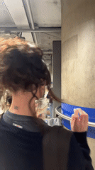 Woman at London Underground station posts about good hair day