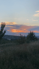 Sunset evening in rural Crimea, hills and golden skies