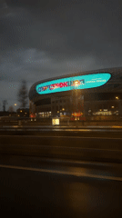 Nighttime drive past illuminated VTB Arena stadium in Moscow