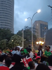 Crowds rally in Nairobi streets with Kenyan flags and green attire