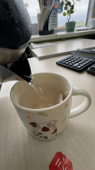 Morning tea preparation observed in Klin, Russia workplace setting