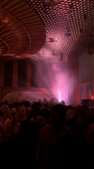 Late-night club scene captured in smoky New York venue