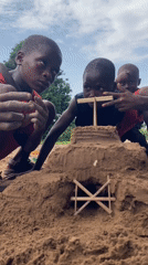 Children build sandcastles during family playtime in Igbara, Nigeria