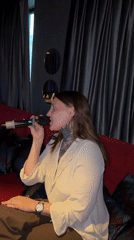 Karaoke night at a dimly lit bar in Izhevsk