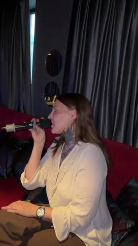 Karaoke night at a dimly lit bar in Izhevsk
