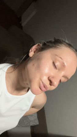 Woman documents evening skincare routine in Esenyurt bathroom
