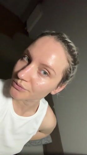Woman documents evening skincare routine in Esenyurt bathroom