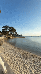 Visitors enjoy spring evening along Antibes coast, France