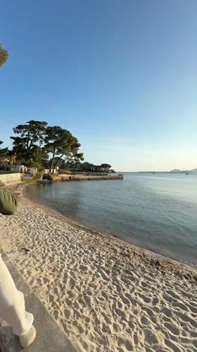 Visitors enjoy spring evening along Antibes coast, France