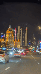 Evening traffic captured on Moscow street from moving vehicle