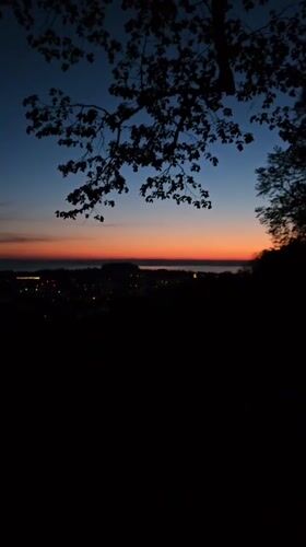 Dawn breaks over St. Gallen cityscape, captured on video