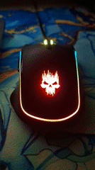 Gaming Setup and Personal Items Documented in Indoor Space