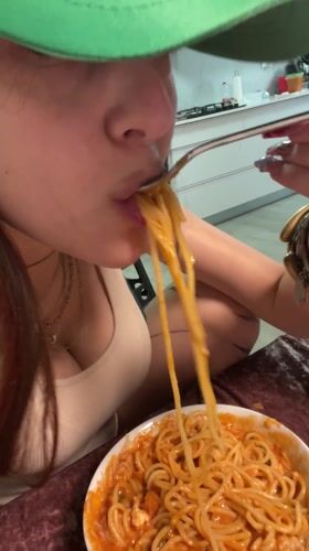 Woman cooks homemade spaghetti dinner in Raanana kitchen
