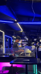 DJ performs at Chiang Mai bar with laptop and equipment