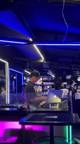 DJ performs at Chiang Mai bar with laptop and equipment