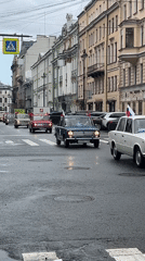 Russian flag-adorned car procession drives through Saint Petersburg streets