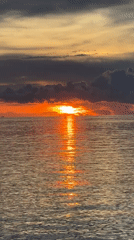 Sunset captured over water in Baan Wok Tum, Thailand